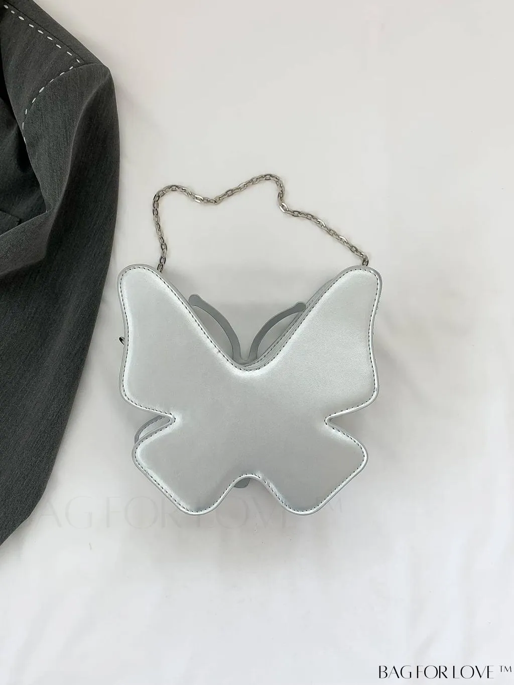 BagForLove - Rivet-Decorated Mini Butterfly PU Bag: Chic and Compact.