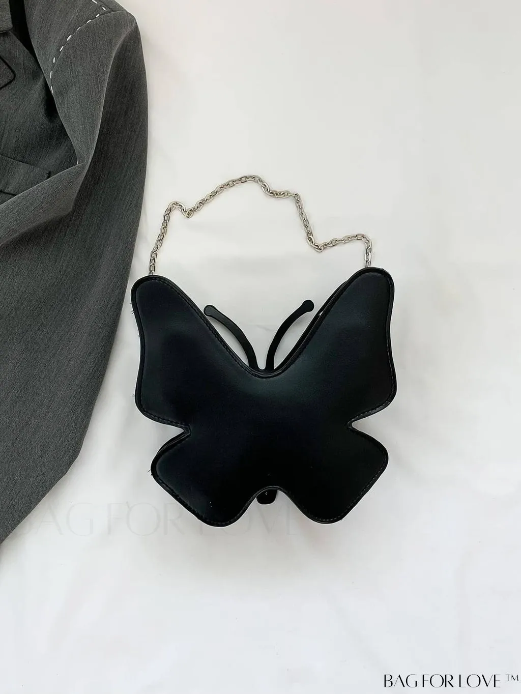 BagForLove - Rivet-Decorated Mini Butterfly PU Bag: Chic and Compact.