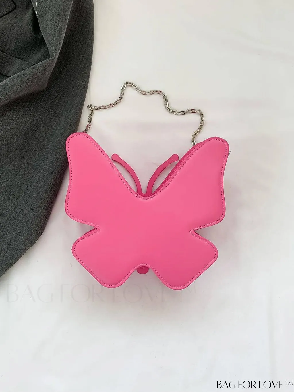 BagForLove - Rivet-Decorated Mini Butterfly PU Bag: Chic and Compact.